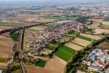Aerial view of Village - view on the edge of agricultural fields and farmland in Studernheim in the state Rhineland-Palatinate, Germany