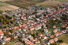 Aerial photograpy of Village - view on the edge of agricultural fields and farmland in Freckenfeld in the state Rhineland-Palatinate