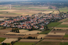 Aerial view of Village - view on the edge of agricultural fields and farmland in Minfeld in the state Rhineland-Palatinate