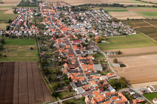 Oblique view of Village - view on the edge of agricultural fields and farmland in Freckenfeld in the state Rhineland-Palatinate