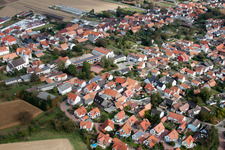 Aerial photograpy of Village - view on the edge of agricultural fields and farmland in Minfeld in the state Rhineland-Palatinate