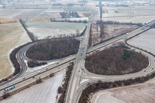 Wintry snowy Routing and traffic lanes during the highway exit and access the motorway A 61 in Hockenheim in the state Baden-Wurttemberg