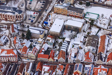 Aerial view of Primary school, town hall in winter when snowing in Kandel in the state Rhineland-Palatinate, Germany
