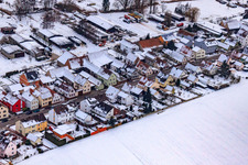 Aerial photograpy of Saarstraße in winter with snow in Kandel in the state Rhineland-Palatinate, Germany
