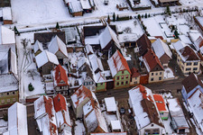 Saarstraße in winter with snow in Kandel in the state Rhineland-Palatinate, Germany from the drone perspective