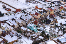 Saarstraße in winter with snow in Kandel in the state Rhineland-Palatinate, Germany seen from a drone