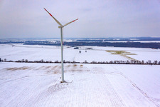 Oblique view of Wind turbines in winter when there is snow in Minfeld in the state Rhineland-Palatinate, Germany