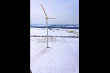 Wind turbines in winter when there is snow in Minfeld in the state Rhineland-Palatinate, Germany from above