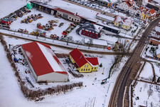Aerial view of Gockelwirt in winter when there is snow in Minfeld in the state Rhineland-Palatinate, Germany