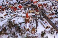 Oblique view of Protest. Church in winter with snow in Minfeld in the state Rhineland-Palatinate, Germany