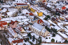 Catholic Church in winter with snow in Minfeld in the state Rhineland-Palatinate, Germany