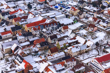 Aerial photograpy of Main street in snow in Freckenfeld in the state Rhineland-Palatinate, Germany