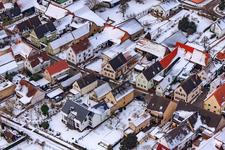 Oblique view of Main street in snow in Freckenfeld in the state Rhineland-Palatinate, Germany