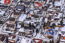 Aerial view of Fleckensteinstraße in snow in Freckenfeld in the state Rhineland-Palatinate, Germany