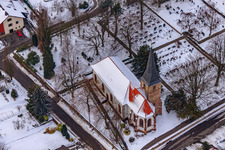 Wolfgangsgang Church in snow in Freckenfeld in the state Rhineland-Palatinate, Germany