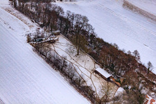 Game reserve at the Gasthaus zur Brauerei in snow in Freckenfeld in the state Rhineland-Palatinate, Germany from above