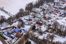 Main street in snow in Vollmersweiler in the state Rhineland-Palatinate, Germany