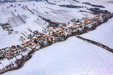 Main street in snow in Vollmersweiler in the state Rhineland-Palatinate, Germany from above