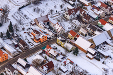 Aerial view of Main street in winter in the snow in the district Kleinsteinfeld in Niederotterbach in the state Rhineland-Palatinate, Germany