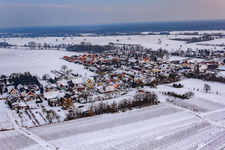 Village view from the northwest in winter in the snow in the district Kleinsteinfeld in Niederotterbach in the state Rhineland-Palatinate, Germany