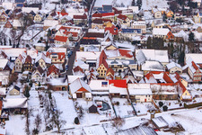 Main street in winter in the snow in Dierbach in the state Rhineland-Palatinate, Germany