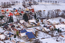 Oblique view of Main street in winter in the snow in Dierbach in the state Rhineland-Palatinate, Germany