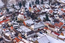 Aerial view of Church in the snow in Barbelroth in the state Rhineland-Palatinate, Germany