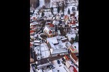 Church in the snow in Barbelroth in the state Rhineland-Palatinate, Germany from above