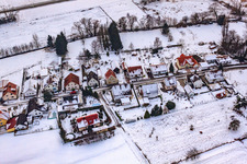 Aerial view of Mühlstraße in the snow in Barbelroth in the state Rhineland-Palatinate, Germany