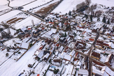 Oblique view of Main street in winter in the snow in Barbelroth in the state Rhineland-Palatinate, Germany