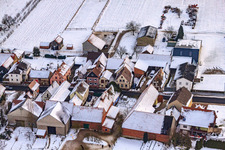 Main street in winter in the snow in Hergersweiler in the state Rhineland-Palatinate, Germany