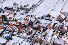 Aerial view of Main street in winter in the snow in Hergersweiler in the state Rhineland-Palatinate, Germany