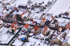 Aerial photograpy of Main street in winter in the snow in Hergersweiler in the state Rhineland-Palatinate, Germany