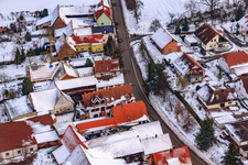 Bird's eye view of Main street in winter in the snow in Hergersweiler in the state Rhineland-Palatinate, Germany