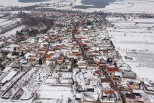 Wintry snowy Village - view on the edge of agricultural fields and farmland in Winden in the state Rhineland-Palatinate, Germany