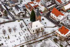 Wintry snowy Church building in the village of in Winden in the state Rhineland-Palatinate, Germany