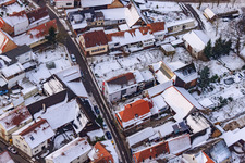 Aerial view of Raiffeisenstraße in the snow in Winden in the state Rhineland-Palatinate, Germany