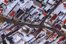 Town hall in the snow in Winden in the state Rhineland-Palatinate, Germany from above