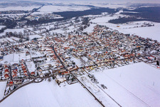 View of the town from the southwest in snow in Steinweiler in the state Rhineland-Palatinate, Germany
