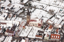 Wintry snowy Catholic Church building in the village of in Steinweiler in the state Rhineland-Palatinate, Germany
