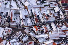 Aerial view of Haselschußgasse in snow in Steinweiler in the state Rhineland-Palatinate, Germany