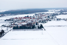 Aerial view of In winter with snow from the west in Erlenbach bei Kandel in the state Rhineland-Palatinate, Germany