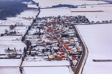 Aerial view of Village view from the west in snow in the district Minderslachen in Kandel in the state Rhineland-Palatinate, Germany