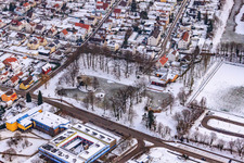 Swan pond frozen in winter in Kandel in the state Rhineland-Palatinate, Germany out of the air