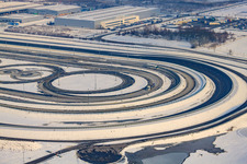 Aerial view of Oberwald industrial area, Daimler truck test track in winter with snow in Wörth am Rhein in the state Rhineland-Palatinate, Germany