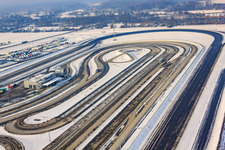 Oberwald industrial area, Daimler truck test track in winter with snow in Wörth am Rhein in the state Rhineland-Palatinate, Germany from the plane
