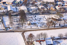 Cemetery in winter with snow in Neupotz in the state Rhineland-Palatinate, Germany
