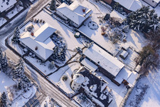 Aerial photograpy of Industrial road in winter with snow in Rheinzabern in the state Rhineland-Palatinate, Germany