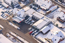 Gas station in winter with snow in Hatzenbühl in the state Rhineland-Palatinate, Germany