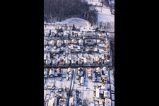 Waldstraße in the Gartenstadt settlement in winter with snow in Kandel in the state Rhineland-Palatinate, Germany